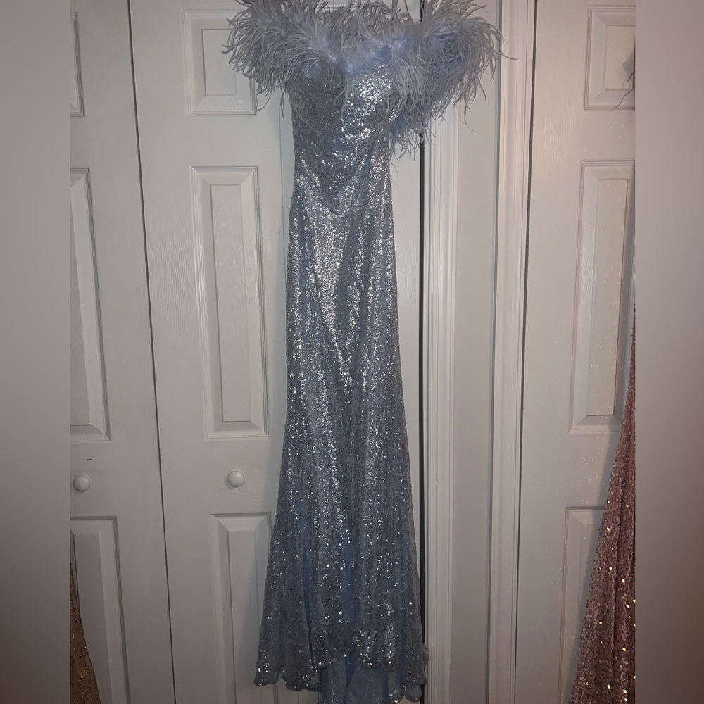 Elegant Silver Sequin Gown with Feather Details